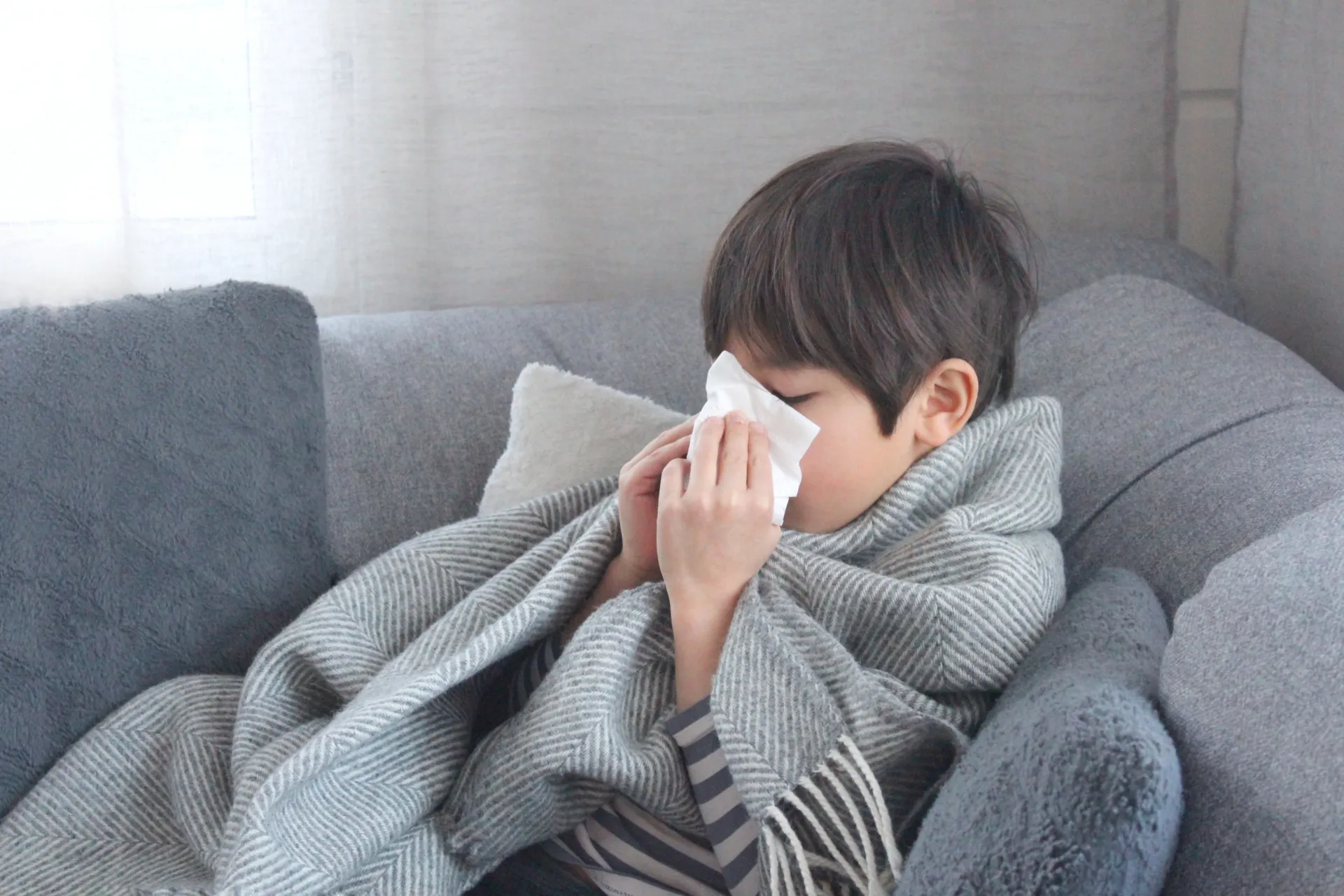 風邪気味な少年